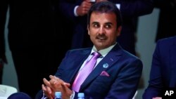 Qatar's Sheikh Tamim bin Hamad Al Thani attends the Paris Peace Forum as part of the commemoration ceremony for Armistice Day, in Paris, Nov. 11, 2018.