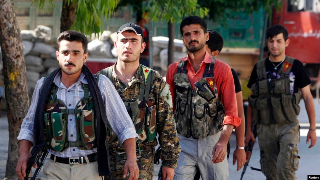 FILE - Kurdish fighters from the Popular Protection Units (YPG).