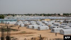 FILE - A tent city for people internally displaced by Boko Haram violence is seen at the unfinished Mohammed Goni Stadium in Maiduguri, Nigeria, July 26, 2019.