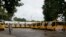 School buses are parked inside the premises of a deserted school compound in Srinagar, Indian controlled Kashmir, Aug. 19, 2019. 