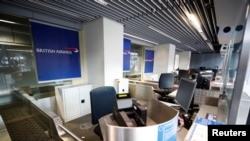 Empty British Airways' counters are pictured at Duesseldorf Airport, as EU countries impose a travel ban from the UK following the coronavirus disease (COVID-19) outbreak, in Duesseldorf, Germany, Dec. 21, 2020. 