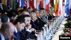 U.N. Envoy to Libya Ghassan Salame, center, attends the second day of the international conference on Libya in Palermo, Italy, Nov. 13, 2018.