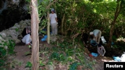 Researchers engage in archaeological excavations at the Nagabaka site on Japan's Miyako island as part of a study that explored the origins of the Transeurasian languages. (Mark Hudson/Handout via REUTERS )