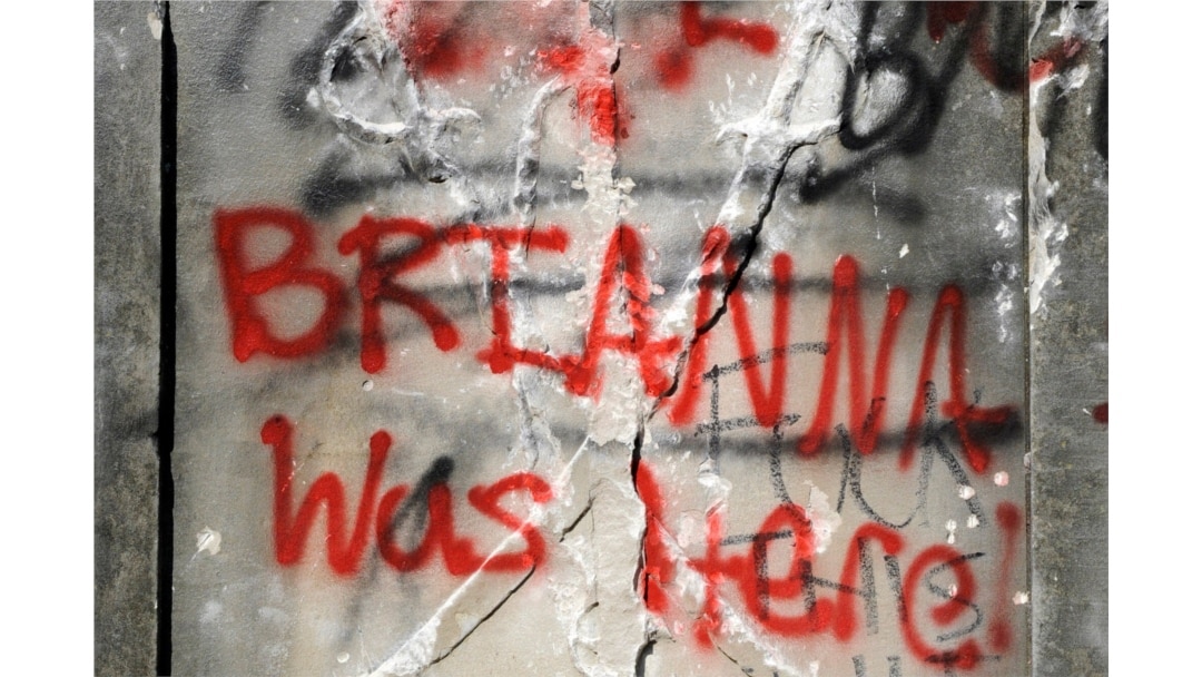 Graffiti is show on the damaged base of a Confederate memorial that was removed overnight in Birmingham, Ala., on June 2, 2020.
