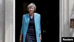 FILE - Britain's Home Secretary, Theresa May, leaves after a cabinet meeting in Downing Street in central London, Britain, June 27, 2016. 