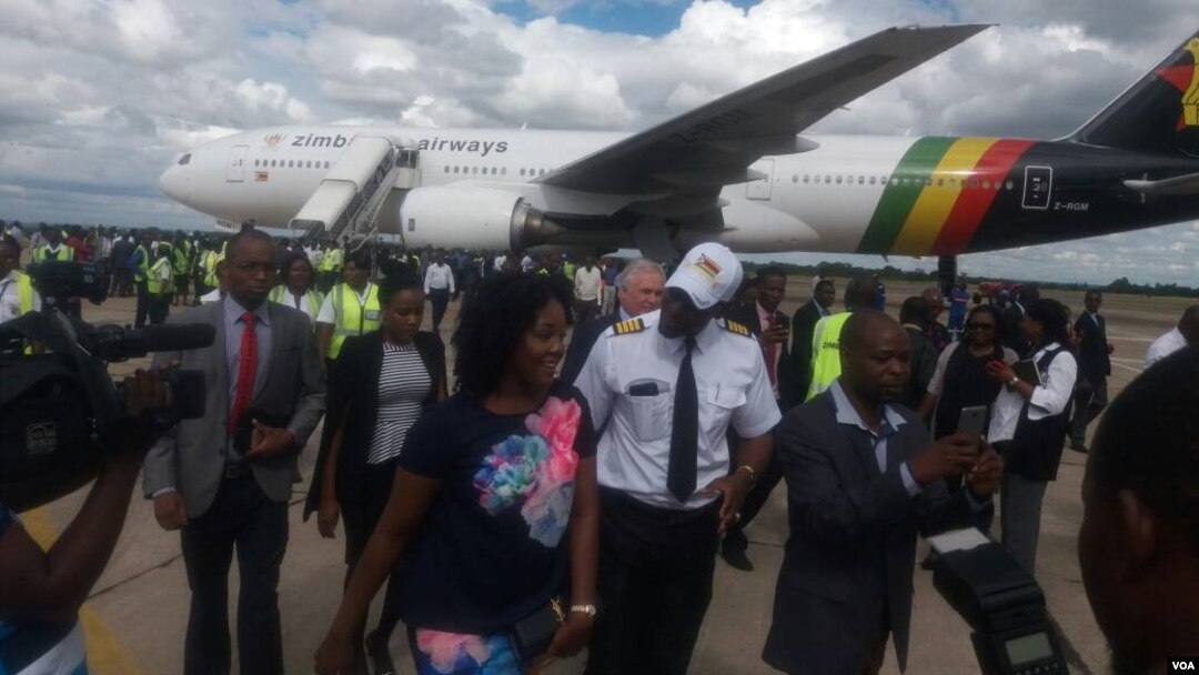 Bona Mugabe Chikore and her husband, Simba Chikore, at the Robert Gabriel Mugabe International Airport on Wednesday.