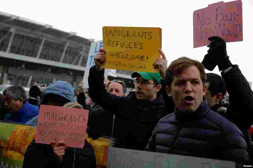 Protesters gather outside Terminal 4 at John F. Kennedy International Airport in Queens, New York, Jan. 28, 2017. 
