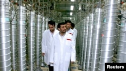 Iranian President Mahmoud Ahmadinejad visits the Natanz nuclear enrichment facility, 350 km south of Tehran, April 8, 2008.