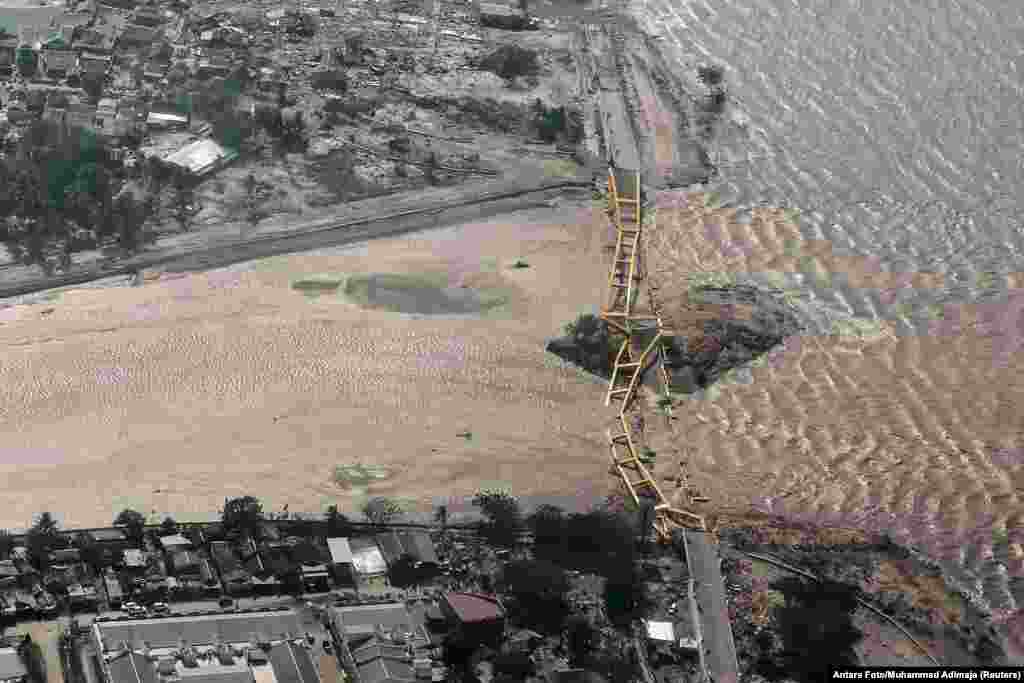 An aerial view shows a bridge damaged by an earthquake and tsunami in Palu, Central Sulawesi, Indonesia, Sept. 29, 2018. 