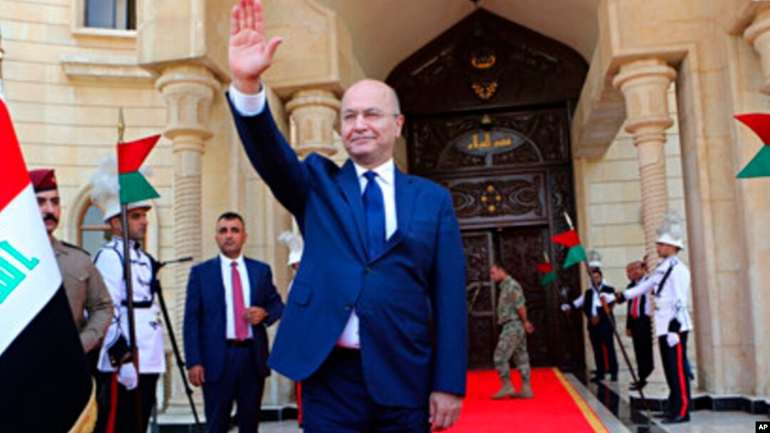 Newly elected Iraq President Barham Salih waves after the inauguration ceremony in Baghdad, Iraq, Oct. 3, 2018. 