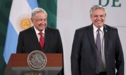 Mexico's President Andres Manuel Lopez Obrador and Argentina's President Alberto Fernandez attend a news conference at the National Palace, in Mexico City, Mexico, Feb. 23, 2021.