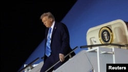 US President Donald Trump steps down from Air Force One upon his arrival in West Palm Beach, Florida, Jan. 31, 2025. 