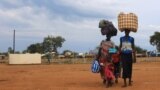 South Sudan refugees family arrives at the U.N. High Commissioner for Refugees-managed refugee reception point at Elegu, in Amuru district of the northern region near the South Sudan-Uganda border, Aug. 20, 2016. 