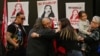 Native American activist Leonard Peltier, imprisoned for decades for the murder of two FBI agents, hugs a relative in Belcourt, North Dakota, on Feb. 19, 2025, a day after leaving prison following former U.S. President Joe Biden's commutation of his sentence to house arrest.