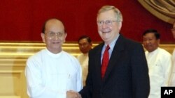 President Thein Sein, left, welcomes U.S. Senate Republican leader Mitch McConnell at the presidential palace Tuesday, Jan. 17, 2012 in Naypyitaw, Myanmar.