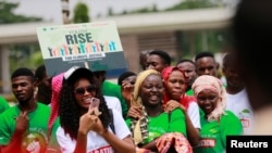FILE - Nigerian youths gather to protest climate change and poor environmental practices, in Abuja, Nigeria, Sept. 20, 2019.