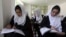 FILE - Girls are seen attending class at a school run by Aid Afghanistan for Education in Kabul, May 2014.