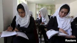 FILE - Girls are seen attending class at a school run by Aid Afghanistan for Education in Kabul, May 2014.