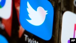 FILE - The Twitter app is seen on a mobile phone in Philadelphia. 