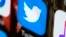 FILE - This April 26, 2017, photo shows the Twitter icon on a mobile phone in Philadelphia.