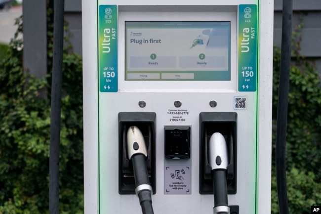 A charging station with Combined Charging System (CCS) plugs is seen in Anaheim, Calif., Friday, June 9, 2023. Owners of General Motors and Ford electric vehicles will be able charge at many of Tesla's large network of stations across the U.S. starting next year. (AP Photo/Jae C. Hong)