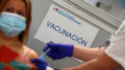 A sign reading "Vaccination" is pictured as Spain resumes vaccination with AstraZeneca shots, amid the coronavirus outbreak, at Enfermera Isabel Zendal hospital in Madrid, Spain, March 24, 2021.