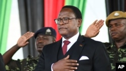 FILE Malawi's newly elected President Lazarus Chakwera takes the oath of office in Lilongwe, Malawi, June 28, 2020. 
