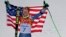 Men's giant slalom gold medalist Ted Ligety of the United States poses for photographers on the podium at the Sochi 2014 Winter Olympics, in Krasnaya Polyana, Russia, Feb. 19, 2014.