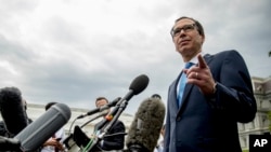 Treasury Secretary Steve Mnuchin takes a question from a reporter outside the West Wing of the White House in Washington, Sept. 9, 2019.