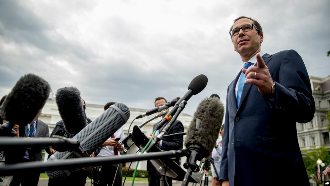 FILE - Treasury Secretary Steve Mnuchin takes a question from a reporter outside the West Wing of the White House in Washington, Sept. 9, 2019.