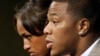 FILE - Janay Rice, left, looks on as her husband, Baltimore Ravens running back Ray Rice, speaks to the media during a news conference in Owings Mills, Md.