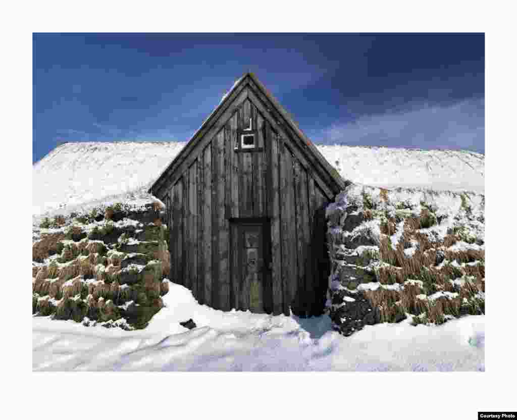 This old farmhouse in southern Iceland reflects the mixture of traditional building styles found on the island. (Feo Pitcairn Fine Art)