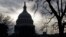 The U.S. Capitol is silhouetted at day's end in Washington, Tuesday, Feb. 14, 2017.