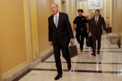 FILE - U.S. Ambassador to the European Union Gordon Sondland arrives at the U.S. Capitol in Washington, Oct. 17, 2019, to testify in impeachment hearings.