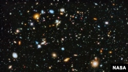 FILE - Astronomers using NASA's Hubble Space Telescope assemble a comprehensive picture of the evolving universe – among the most colorful deep space images ever captured by the 24-year-old telescope. 