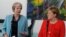 German Chancellor Angela Merkel, right, and British Prime Minister Theresa May give statements prior to a meeting in the chancellery in Berlin, Germany, July 5, 2018. 
