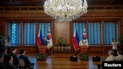 Philippine President Ferdinand Marcos Jr., right, delivers his speech during his meeting with South Korean President Yoon Suk Yeol at the Malacanang Palace in Manila, Philippines, October 7, 2024.