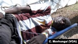 A patient receiving treatment at a temporary structure in Harare, Zimbabwe, Sept. 11, 2018, meant for waterborne diseases such as salmonella, typhoid and cholera which have hit Zimbabwe’s capital city. 