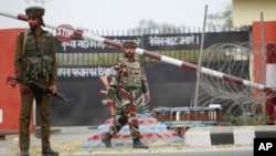 Indian soldiers are seen outside an army camp at Nagrota, in the outskirts of Jammu, Nov. 29, 2016. 