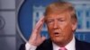 FILE - President Donald Trump answers a question during a news conference on the coronavirus outbreak, at the White House in Washington, Feb. 26, 2020.