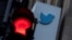 FILE - A view of the Twitter logo at its corporate headquarters in San Francisco, California, Nov. 18, 2022.