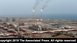 FILE - Natural gas refineries are seen at the South Pars gas field on the northern coast of the Persian Gulf, in Asaluyeh, Iran, March 16, 2019.