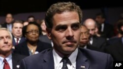 FILE - Hunter Biden waits for the start of the his father's, Vice President Joe Biden's, debate at Centre College in Danville, Ky.