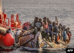 A boat from Senegal carrying 136 migrants, including 40 women and 17 young children, arrives after being rescued at sea by a Spanish search and rescue vessel at La Restinga port on the Canary island of El Hierro on Nov. 28, 2024.