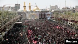 Shi'ite pilgrims gather during the religious festival of Ashura in the holy city of Kerbala, Iraq, Sept. 10, 2019.