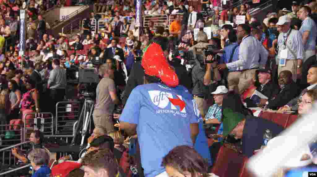 Delegates sport their hats at the DNC in Philadelphia (Photo: S. Barua/VOA)