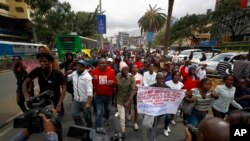 FILE: In an earlier anti-tax hike protest, Kenyans march in the street in Nairobi during a protest against the finance bill on Tuesday, June 6, 2023.