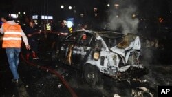 FILE - Members of emergency services work at the scene of an explosion in Ankara, Turkey, March 13, 2016.