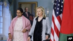 Secretary of State Hillary Rodham Clinton and Bangladeshi Foreign Minister Dipu Moni, arrive to speak with reporters following a bilateral meeting at the State Department in Washington.