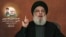 Sebuah gambar yang diambil dari TV al-Manar milik Hizbullah tanggal 10 Juli 2024, menunjukkan pemimpin Hizbullah Hassan Nasrallah memberikan pidato yang disiarkan televisi dari lokasi yang dirahasiakan di Lebanon.